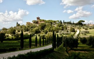 Tuscany landscape with cypress-lined road leading to historic villa – romantic Italian setting