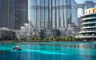 Burj Khalifa with poolside towers reflecting in water – iconic Dubai landmark