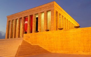 Sunlit Turkish flag and Atatürk Mausoleum at Anıtkabir, Ankara