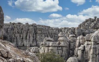 Jagged gray limestone peaks – dramatic stone formations under a bright sky in El Torcal de Antequera, Andalusia
