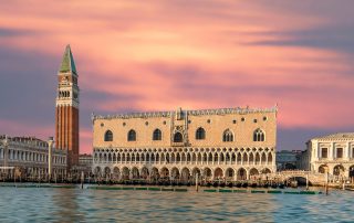 Sunset view of Doge’s Palace and canal in Venice, Italy – cinematic water reflections