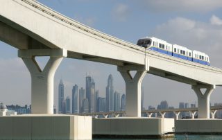 Dubai skyline seen from monorail track with modern transport infrastructure