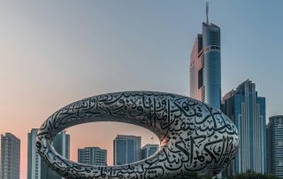 Museum of the Future and Emirates Towers in Dubai under soft sunrise