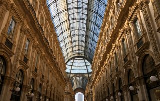 Interior of Galleria Vittorio Emanuele II with ornate glass ceiling in Milan, Italy