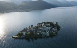 Lake island village in Northern Italy – serene landscape ideal for tranquil filming settings.