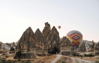 Cave dwellings and rocky spires of Cappadocia in soft morning light