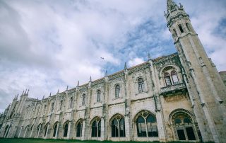 Ornate historic building with baroque-style architecture – cultural landmark under dramatic skies