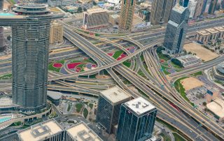 Aerial view of urban highway system and city blocks in Dubai