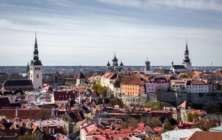 Aerial view of Tallinn’s historic Old Town with colorful rooftops and church towers