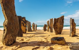 Sunlit rock formations in Algarve’s beach canyon – natural coastal wonder in southern Portugal
